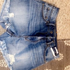 BNWT medium wash woman’s size three denim shorts. Never worn brand new distresse